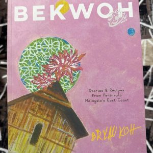 Used Book - BEKWOH - Stories & Recipes from Peninsula Malaysia's East Coast - Bryan Koh - From The Award Winning Author of " Milk Pigs & Violet Gold " and " 0451 Mornings are from Mont Hin Gar " - Bekwoh unfolds as a culinary journey along Malaysia’s East Coast — from Terengganu’s fishing villages, where keropok lekor is crafted by hand, to Kota Bharu’s bustling central market, alive with an irresistible array of kuih. The trail continues north to Tumpat for khao jam, then south to Pahang, where roadside stalls dish out smoky lemang and rich rendang. Along the way, it weaves in the everyday and celebratory dishes of the Peranakan Chinese communities of Kelantan and Terengganu. Rooted in an East Coast word for cooking vessels, Bekwoh has come to symbolize generosity, abundance, and shared joy. These are the qualities Bryan brings to the table, offering more than 100 recipes that celebrate food as a source of warmth, culture, and togetherness.