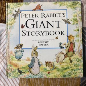 Used Book - Peter Rabbit's Giant Story Book - The Original and Authorized Edition By Beatrix Potter - The World of Peter Rabbit - Frederick Warne - Hardbound - This hardbound edition of Peter Rabbit’s Giant Story Book is a magnificent tribute to Beatrix Potter’s enduring legacy. Featuring the original, authorized artwork, it brings the charming world of the Lake District to life. This oversized treasure is a timeless heirloom, perfect for sharing the whimsical adventures of Peter and friends.