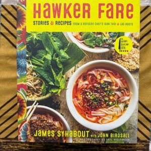 Used Book - Hawker Fare - Stories & Recipes - From A Refugee Chef's Isan Thai @ Lao Roots - James Syhabout with John Birdsall - Photography By Eric Wolfinger - Easy & Essential - An Anthony Bourdain Book (Hardbound) - Hawker Fare is a deeply personal, soul-stirring journey into the bold flavors of Isan Thai and Lao roots. James Syhabout masterfully blends grit and grace, delivering essential recipes with the spirit of street food culture. Gritty, authentic, and visually stunning, it’s a powerful tribute to heritage, resilience, and flavor.