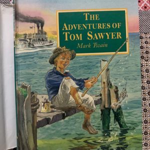 Used Book - The Adventures of Tom Sawyer - Mark Twain - Parragon UK Hardbound - This Parragon hardbound edition is a beautiful tribute to Mark Twain’s quintessential American classic. Through Tom’s mischievous escapades, the narrative captures the pure, rebellious spirit of youth. Elegant craftsmanship meets timeless storytelling, making this sturdy volume a perfect way to experience the wit, nostalgia, and enduring charm of the Mississippi.