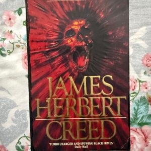 Second Hand Books - James Herbert - CREED - Horror Turbo Charged And Spewing Black Fumes - James Herbert’s Creed is a relentless, high-octane descent into supernatural terror. Atmospheric and uncompromising, the narrative pulses with a gritty energy that Herbert himself describes as "turbo-charged." It is a dark, visceral masterpiece of the genre—spewing black fumes of dread that linger long after the final, chilling page is turned.
