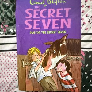 Used Book - Enid Blyton - Fun For The Secret Seven - Hachette India - Fun for the Secret Seven is a heartwarming conclusion to the series, skillfully blending mystery with deep compassion. As the group helps a boy and his clever horse, Tolly, Enid Blyton delivers a poignant story about kindness and protection. It’s a beautifully paced adventure that proves the Seven’s greatest strength is their empathy.