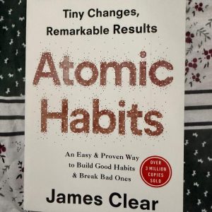 Used Book - Atomic Habits - James Clear - Tiny Changes, Remarkable Results - James Clear’s Atomic Habits is a masterclass in behavioral change. By breaking down habit formation into actionable, bite-sized strategies, it shifts your focus from overwhelming goals to daily systems. This transformative guide proves that compounding tiny choices yields remarkable results, making it an essential roadmap for anyone seeking lasting personal growth.