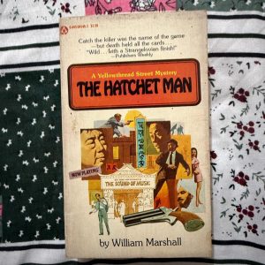 Used Book - The Hatchet Man - William Marshall - A Yellowthread Street Mystery - The Hatchet Man is a brilliant, razor-sharp entry in William Marshall’s Yellowthread Street series. Masterfully blending surreal, chaotic dark humor with a gritty police procedural, it vividly captures the frantic energy of Hong Kong's fictional district. A thrilling, eccentric, and atmospheric mystery that keeps readers hooked from start to finish.