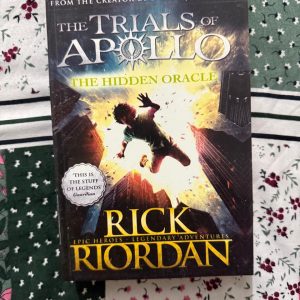 Second Hand Book - The Hidden Oracle - Rick Riordan - Epic World - Legendary Adventures - Return To Percy Jackson's World - The Trials of Apollo - The Hidden Oracle is a spectacular, fast-paced triumph that brilliantly kicks off Rick Riordan’s The Trials of Apollo series. Transforming an arrogant, fallen deity into a hilariously flawed mortal teenager, it effortlessly blends mythic danger with laugh-out-loud humor. This legendary return to Percy Jackson's world is an absolute, action-packed must-read.