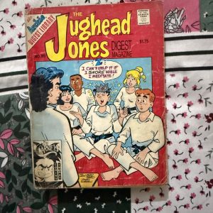 Second hand Book - Jughead Jones Digest Magazine - Jughead Jones Comics Digest Magazine is a hilarious tribute to Riverdale’s premier burger-loving nonconformist. Bursting with classic adventures, crown-wearing antics, and his trademark sarcastic wit, this pocket-sized powerhouse delivers double the laughs. It is a delightfully charming read that perfectly celebrates the ultimate lazy genius and his timeless comic escapades.