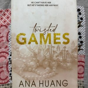 Used Book - Twisted Games - Ana Huang - An unforgettable royal romance, Twisted Games delivers a flawless, forbidden, bodyguard-princess dynamic. Ana Huang masterfully handles the scorching slow-burn tension, high-stakes duty, and explosive chemistry between Rhys and Bridget. It is a thrilling, addictive, and deeply emotional journey where love fiercely defies the crown, capturing your heart completely.