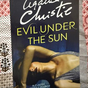 Used Book - Agatha Christie - Evil Under The Sun - A Classic Hercule Poirot Mystery - A brilliant exercise in misdirection, Evil Under the Sun turns a glamorous seaside holiday into a chilling psychological puzzle. Agatha Christie masterfully cuts through a web of flawless alibis, letting Hercule Poirot expose the dark human motives beneath the summer glow. It’s an atmospheric, tightly plotted, and utterly unforgettable classic.