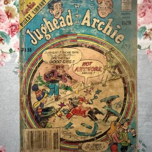 Used Book - Jughead With Archie – Jughead Comics Digest Magazine is a hilarious tribute to Riverdale’s premier burger-loving nonconformist. Bursting with classic adventures, crown-wearing antics, and his trademark sarcastic wit, this pocket-sized powerhouse delivers double the laughs. It is a delightfully charming read that perfectly celebrates the ultimate lazy genius and his timeless comic escapades.