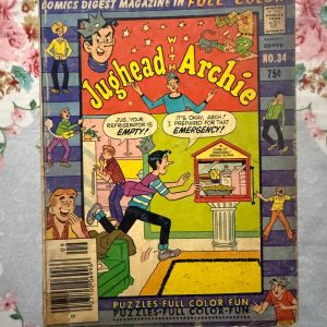 Used Book - Jughead With Archie – Vintage Edition - Jughead Comics Digest Magazine is a hilarious tribute to Riverdale’s premier burger-loving nonconformist. Bursting with classic adventures, crown-wearing antics, and his trademark sarcastic wit, this pocket-sized powerhouse delivers double the laughs. It is a delightfully charming read that perfectly celebrates the ultimate lazy genius and his timeless comic escapades.