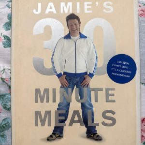 Used Book - Jamie's 30 Minutes Meals - A Revolutionary Approach To Cooking Good Food Fast - Jamie Oliver’s 30-Minute Meals is a culinary game-changer that brilliantly fulfills its promise of fast, delicious food. This revolutionary masterpiece strips away kitchen stress with clever, streamlined menus and dynamic techniques. Packing every page with vibrant flavors and effortless joy, it is an indispensable treasure for modern, busy cooks.