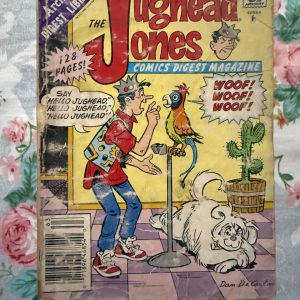 Second hand Book - Jughead Jones Comics Digest Magazine - Jughead Jones Comics Digest Magazine is a hilarious tribute to Riverdale’s premier burger-loving nonconformist. Bursting with classic adventures, crown-wearing antics, and his trademark sarcastic wit, this pocket-sized powerhouse delivers double the laughs. It is a delightfully charming read that perfectly celebrates the ultimate lazy genius and his timeless comic escapades.