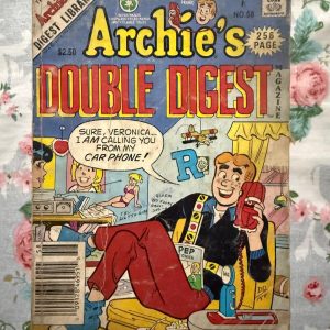Second hand Book - Jughead's Double Digest Magazine - Vintage Edition - Jughead Double Digest is a masterclass in comic relief, perfectly capturing Riverdale’s favorite food-loving, crown-wearing cynic. Packed with double the classic mishaps, burger-craving escapades, and his brilliant, lazy-genius wit, it’s a delightfully lighthearted read. This pocket-sized treasure chest guarantees laugh-out-loud entertainment for comic fans of all generations.