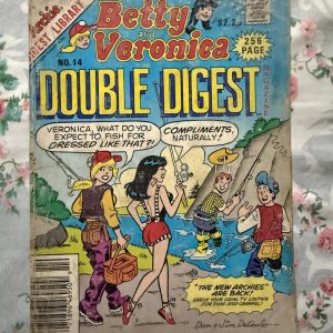 Second hand Book - Betty & Veronica - Double Digest - Betty & Veronica Double Digest serves up a double helping of Riverdale’s premier friendship and rivalry. Filled with twice the fashion, dating dilemmas, and classic humor, it perfectly captures the enduring bond between the ultimate girl-next-door and the glamorous heiress. It is a vibrant, pocket-sized goldmine of timeless, feel-good fun.