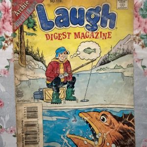 Used Book - LAUGH Comics Digest Magazine - Laugh is a hilarious tribute to Riverdale’s premier burger-loving nonconformist. Bursting with classic adventures, crown-wearing antics, and his trademark sarcastic wit, this pocket-sized powerhouse delivers double the laughs. It is a delightfully charming read that perfectly celebrates the ultimate lazy genius and his timeless comic escapades.