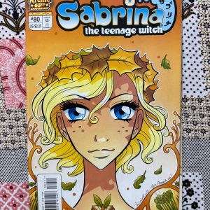 Used Book - This Sabrina the Teenage Witch Jumbo Size edition is a magical, spellbinding treat! Packed with supernatural mishaps, high school drama, and Salem’s iconic snark, it showcases the ultimate teenage witch at her finest. With nostalgic artwork and enchanting, feel-good stories, this massive collection delivers pure, timeless joy for Archie fans everywhere.
