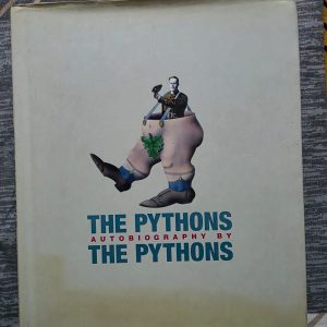 Used Book - The Pythons - Autobiography By The Pythons - The Pythons: Autobiography by The Pythons is a hilarious, definitive, and wonderfully chaotic oral history. Through candid interviews, rare archives, and behind-the-scenes photographs, the legendary troupe pulls back the curtain on their surreal genius. It is a brilliant, must-read celebration of comedic history, perfectly capturing the spirit that changed comedy forever.