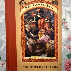 Used Book - A Series of Unfortunate Events - The Penultimate Peril - Lemony Snicket - Illustrations by Brett Helquist - The Penultimate Peril is a masterful, tension-filled climax that brilliantly converges the seriesтАЩ sprawling mysteries. Lemony SnicketтАЩs sharp wit and philosophical depth reach new heights as the Baudelaire orphans face moral ambiguity at the Hotel Denouement. Brett HelquistтАЩs evocative illustrations perfectly underscore this haunting, profound, and unforgettable penultimate journey.