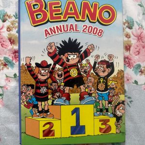 Used Book - The BEANO Annual - 2008 - A Mischievous World of Beano - The Beano Annual 2008 is a vibrant, side-splitting riot of comic brilliance. Overflowing with bold artwork and razor-sharp wit, it brings Dennis the Menace, Minnie the Minx, and the whole crew together for unforgettable, chaotic adventures. Bursting with cheeky charm and endless laughs, this festive treasure is pure joy!