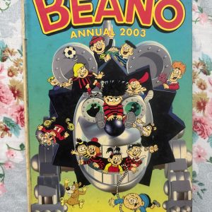 Used Book - The BEANO Annual - 2003 - A Mischievous World of Beano - The Beano Annual 2003 is a brilliant riot of classic comic mischief and unstoppable laughs. Bursting with vibrant artwork and hilarious capers from Dennis the Menace, the Bash Street Kids, and the gang, it delivers pure entertainment. Packed with cheeky charm and timeless humor, this wonderful collection is absolute perfection!