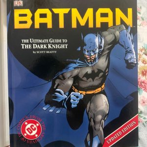 Used Book - BatMan - The Ultimate Guide To The Dark Knight By Scott Breatty - DC Comics (Hardbound) - *Batman: The Ultimate Guide to the Dark Knight* by Scott Beatty is an indispensable treasure for every Gotham fan. Brimming with stunning DC Comics artwork, rich lore, and exhaustive character histories, this definitive volume brilliantly maps the legacy of the Caped Crusader. An essential masterpiece for your collection!